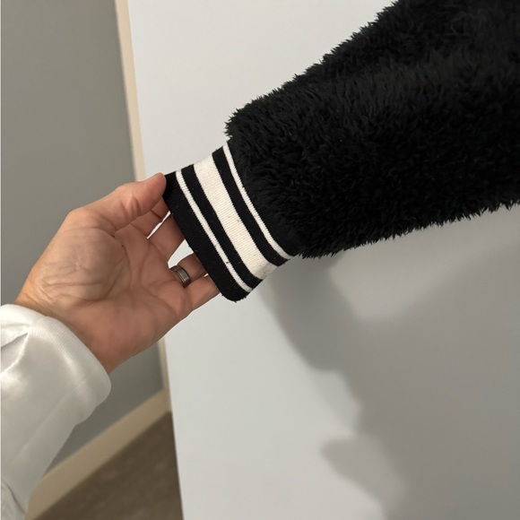Carve designs black Sherpa v-neck with cute striping on sleeves and waist. - Picture 2 of 3